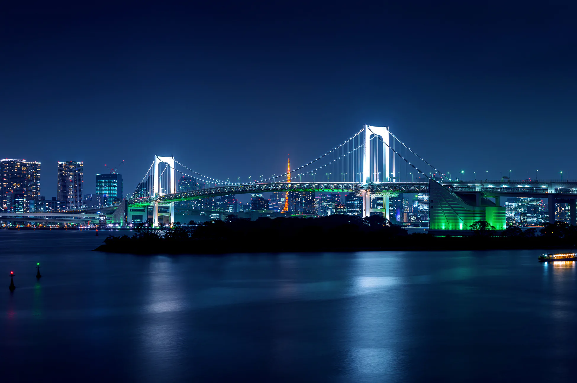 Rainbow Bridge and Tokyo Bay at night on a JDM route